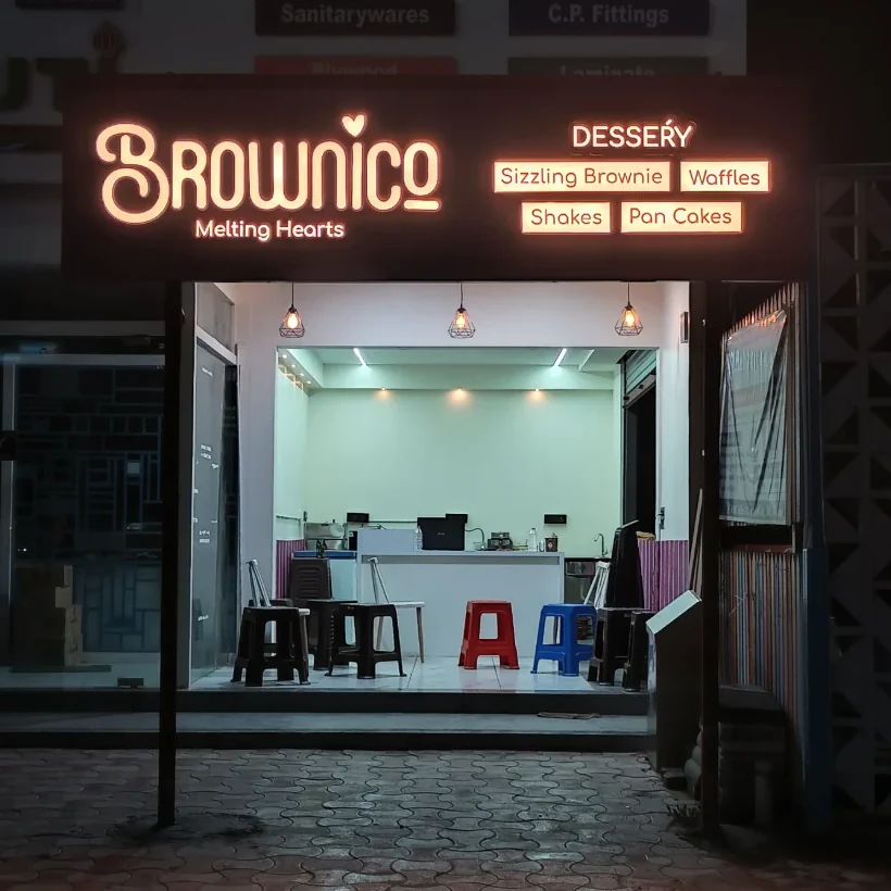 Brownico Gota's illuminated sign and dessert counter